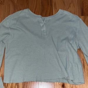 Turquoise cropped top.